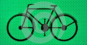 Black bicicle on a green background