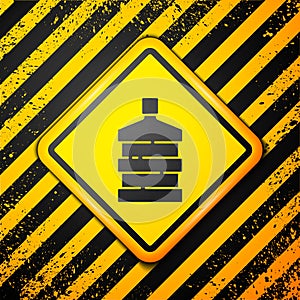 Black Big bottle with clean water icon isolated on yellow background. Plastic container for the cooler. Warning sign
