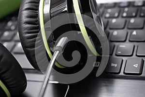 Black Big Wired Gaming Headset Lying On The Keyboard Of A Laptop