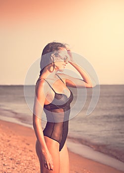 Black bikini sea, sunglasses, close up, toned