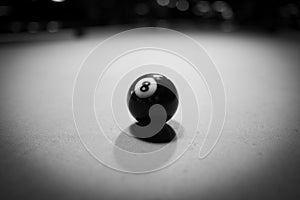 the black billiard ball is on the billiard table