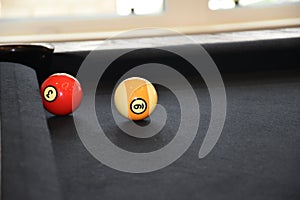 Black billiard table, Billiard balls in a pool table, focused on 9 ball