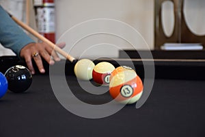 Black billiard table, Playing billiard - Close-up shot of a man playing billiard