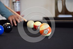 Black billiard table, Playing billiard - Close-up shot of a man playing billiard