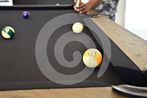 Black billiard table, Playing billiard - Close-up shot of a man playing billiard