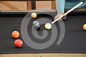 Black billiard table, Playing billiard - Close-up shot of a man playing billiard