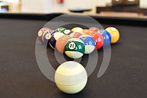 Black billiard table, Playing snooker pool 8ball - Close-up shot of a man playing billiard