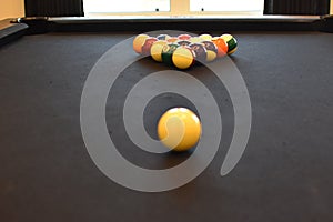 Black billiard table, Playing snooker pool 8ball - Close-up shot of a man playing billiard