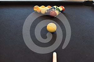 Black billiard table, Playing snooker pool 8ball - Close-up shot of a man playing billiard