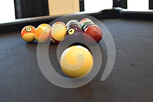 Black billiard table, Playing snooker pool 8ball - Close-up shot of a man playing billiard