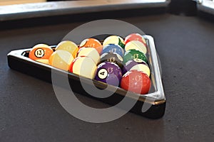 Black billiard table, Playing snooker pool 8ball - Close-up shot of a man playing billiard