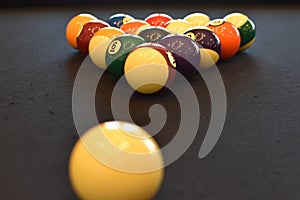 Black billiard table, Playing snooker pool 8ball - Close-up shot of a man playing billiard photo