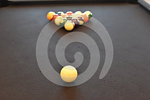 Black billiard table, Playing snooker pool 8ball - Close-up shot of a man playing billiard photo