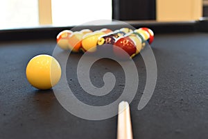 Black billiard table, Playing snooker pool 8ball - Close-up shot of a man playing billiard photo