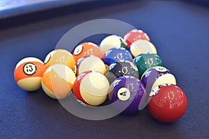 Black billiard table, Playing snooker pool 8ball - Close-up shot of a man playing billiard photo