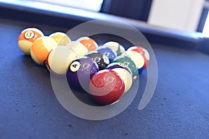 Black billiard table, Playing snooker pool 8ball - Close-up shot of a man playing billiard photo