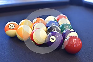 Black billiard table, Playing snooker pool 8ball - Close-up shot of a man playing billiard photo