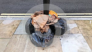 Black bin bags and waste not collected due to a council staff strike.