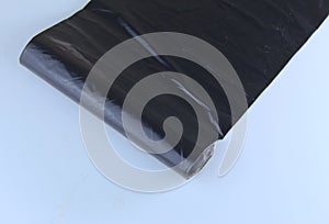 Black bin liner rolled out
