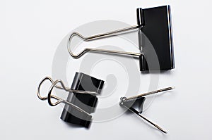 Black binder clip isolated on white background