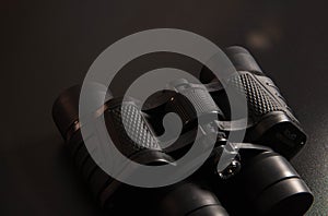 Black binoculars isolated on white background