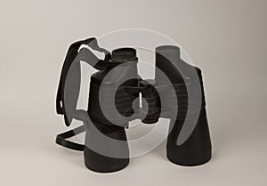 A black binoculars on a white background