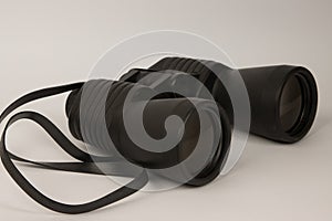 A black binoculars on a white background