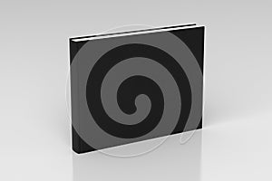 Black blank book textured cover with landscape orientation standing isolated on white background with clipping path.