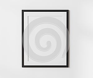 Black blank frame with mat on white wall mockup, 4:5 ratio - 40x50 cm, 16 x 20 inches, poster frame mockup, 3d rendering