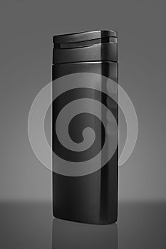 Black Blank Shampoo Bottle Isolated on Gray