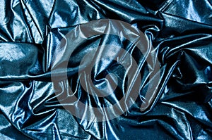 Black blue cloth waves abstract textile background. Fabric as pitch oil. Dark wallpaper.