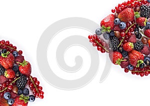 Black-blue and red food. Ripe blueberries, red currants, raspberries, strawberries, gooseberries on a white background.