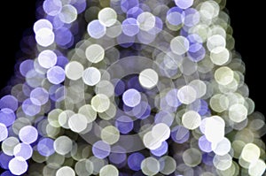 Black,blue and white blurred picture of christmas lights, monochromatic abstract background.