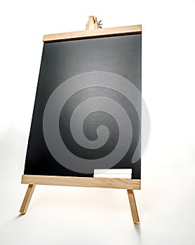 Black board with of two pieces of chalks on wooden easel isolated on white background