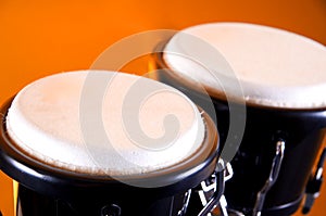 Black Bongos Isolated on Orange photo