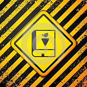 Black Book about grapes icon isolated on yellow background. Warning sign. Vector