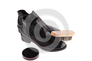 black boots with shoe brush