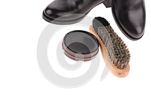 black boots with shoe brush