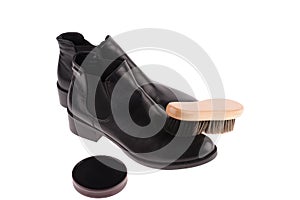 Black boots with shoe brush