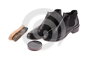 Black boots with shoe brush