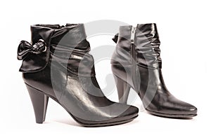 Black boots on white