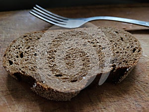 black borodino bread on a wooden background