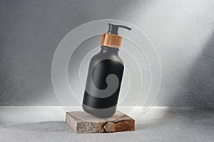 Black bottle with dispenser pump for liquid soap, gel, lotion, cream, shampoo and other cosmetics