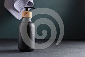 Black bottle with dispenser pump for liquid soap and other barh products