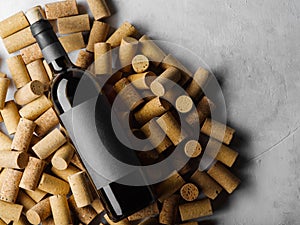 Black bottle of red wine, on corks .on white background, for text advertising, banner