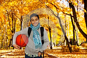 Black boy with ball in park