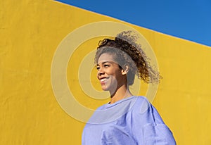 Black brazilian woman smiling with sunlight