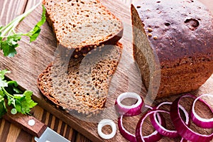 Black bread with bran and red onion and parsley