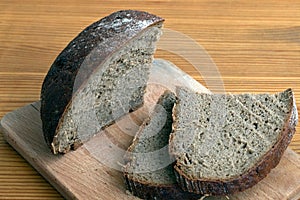 Black bread slices on the cutting board
