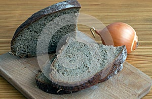 Black bread slices on the cutting board